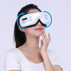 A woman wearing a white and black facial massage mask with blue circular graphic arrows indicating airflow.