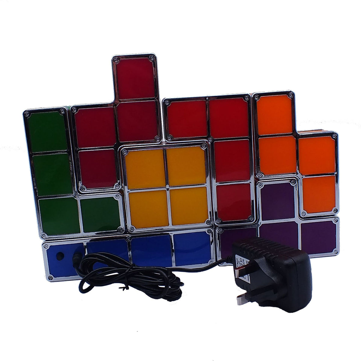 Colorful LED light panel with power adapter on a white background